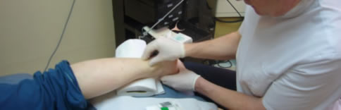 The athlete is receiving a deep friction massage after her ultrasound treatment for Achilles Tendinitis.